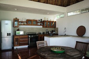 Private kitchen - Comfortable Beach House in Bahia de Salchi walking 5 minutes to the beach.  (Unknown)