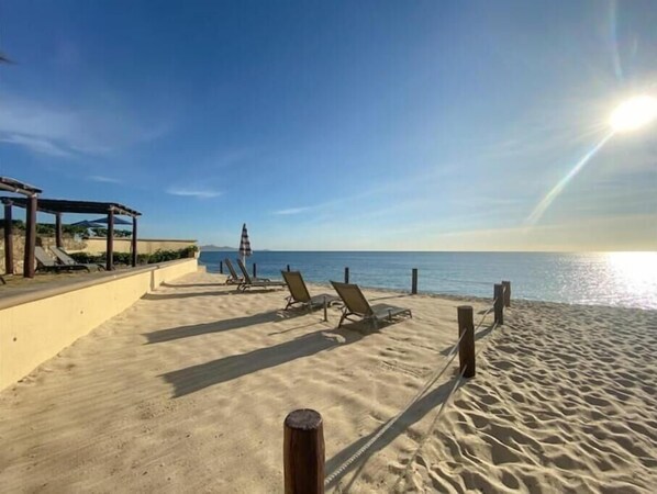 On the beach, sun-loungers, beach towels