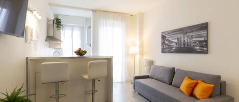 Appartement Confort | Coin séjour | Télévision à écran plat