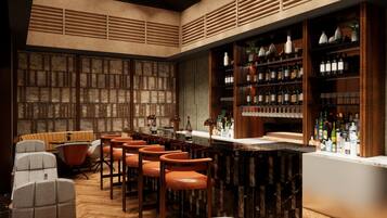 A bar area with wooden shelves, bar stools, and a marble counter.