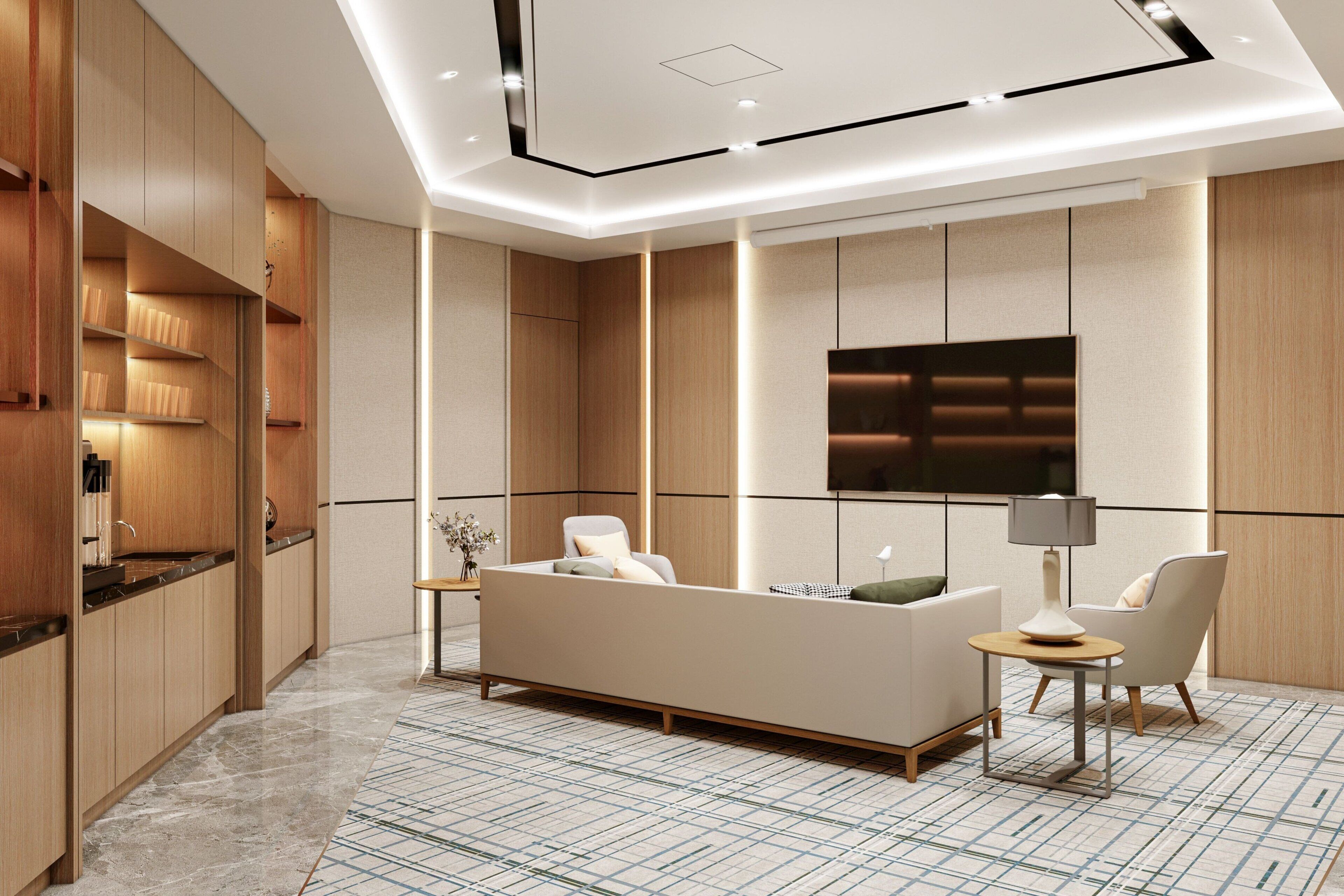 A modern living room with a sofa, chairs, a TV, and a kitchen area with wooden cabinets and a marble floor.
