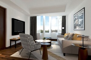 Suíte, 1 quarto | Sala de estar | Smart TV 55 polegadas com canais a cabo