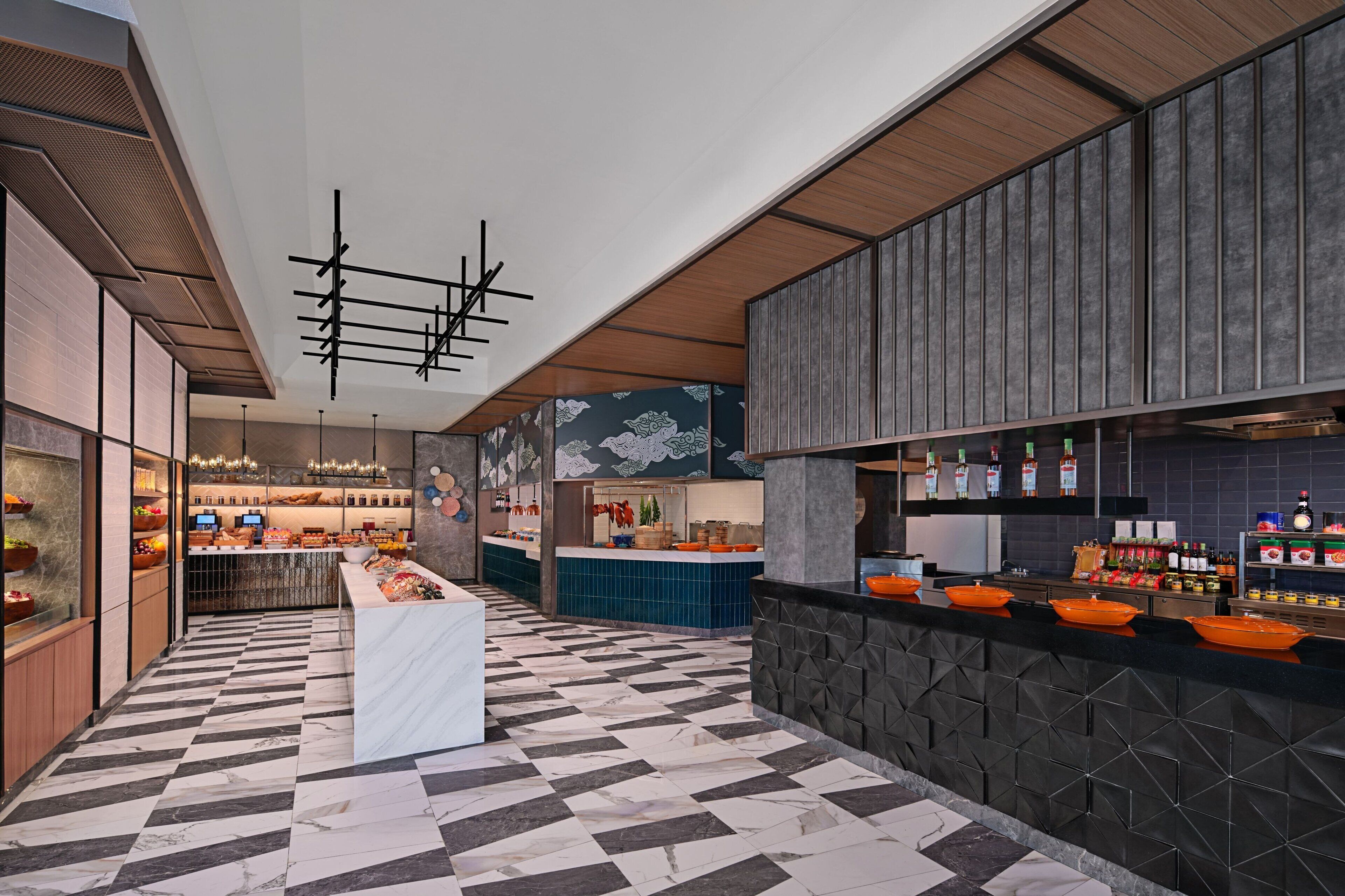 A modern kitchen with a checkered floor, wooden cabinets, and a central island.