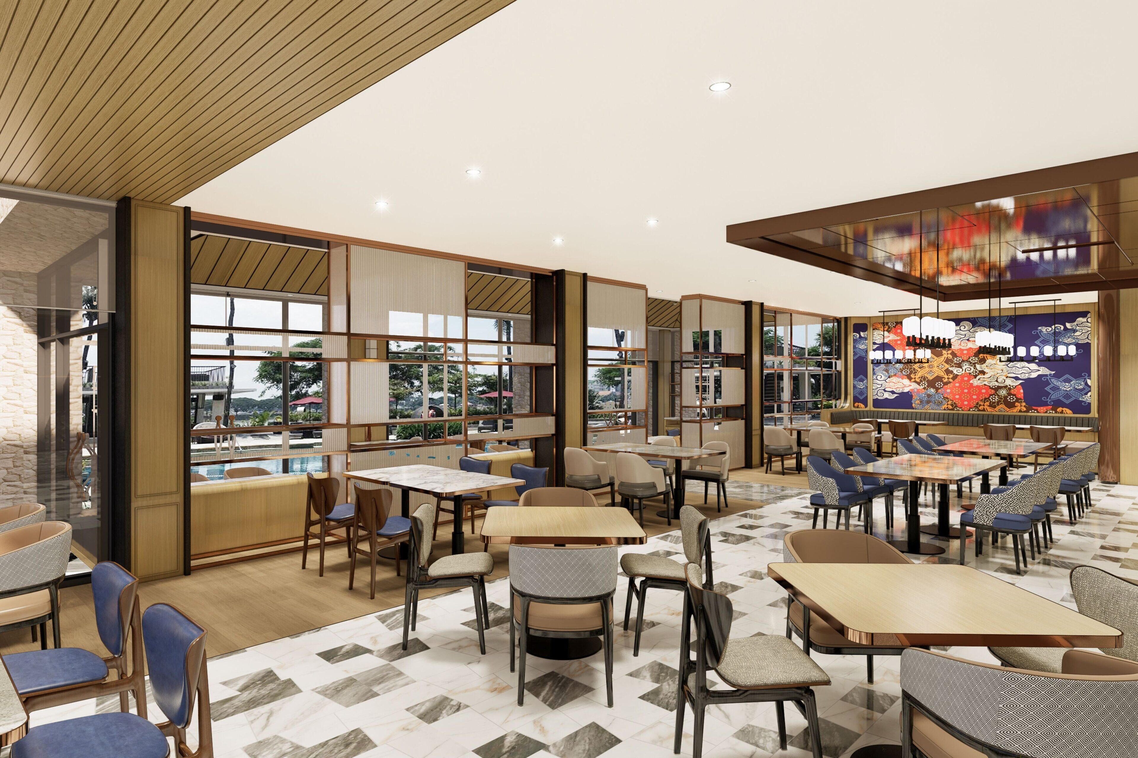 A modern dining area with multiple tables and chairs, large windows, and a decorative wall mural.