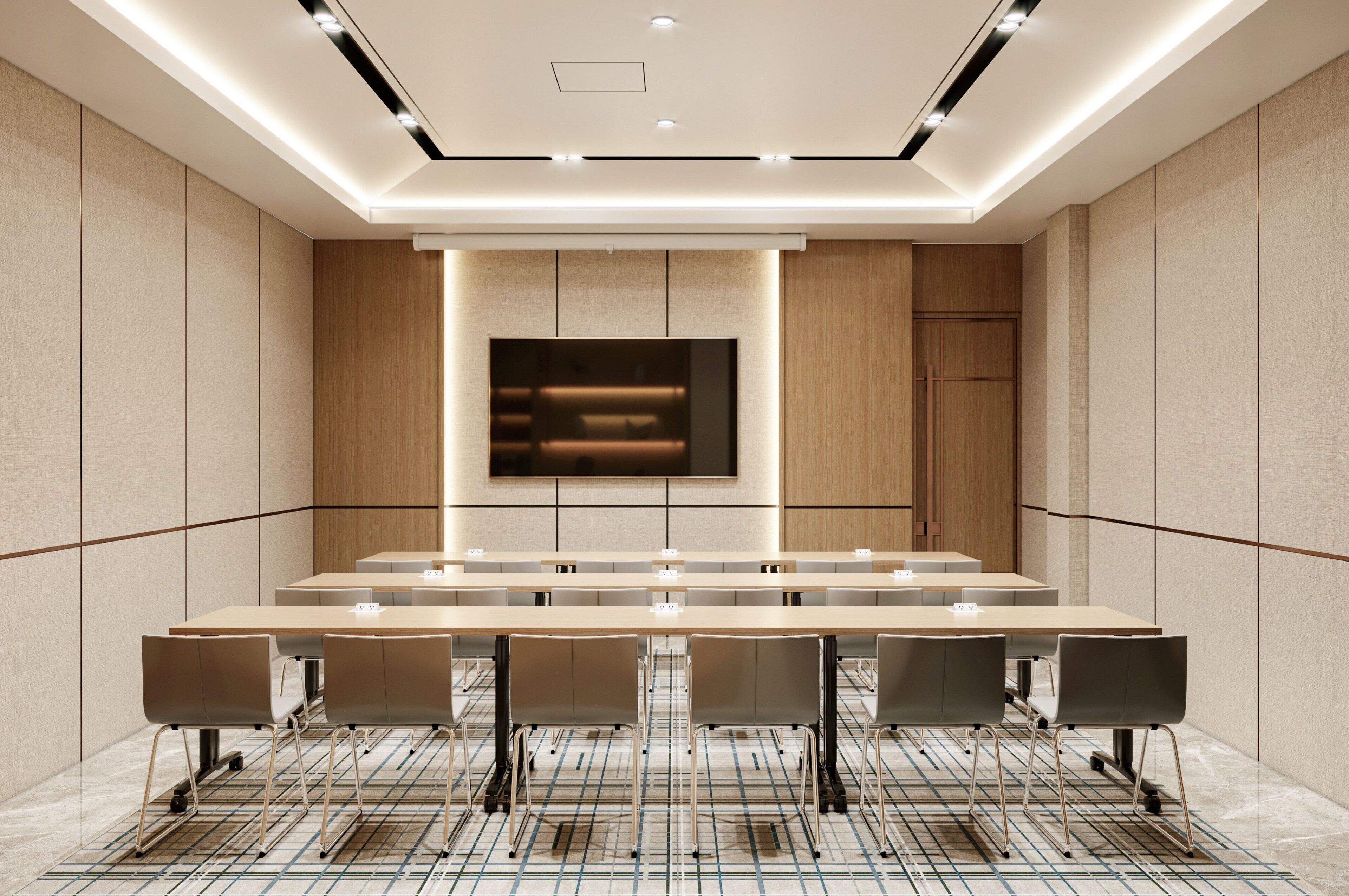A modern conference room with a long table, chairs, a flat-screen TV, and recessed lighting.
