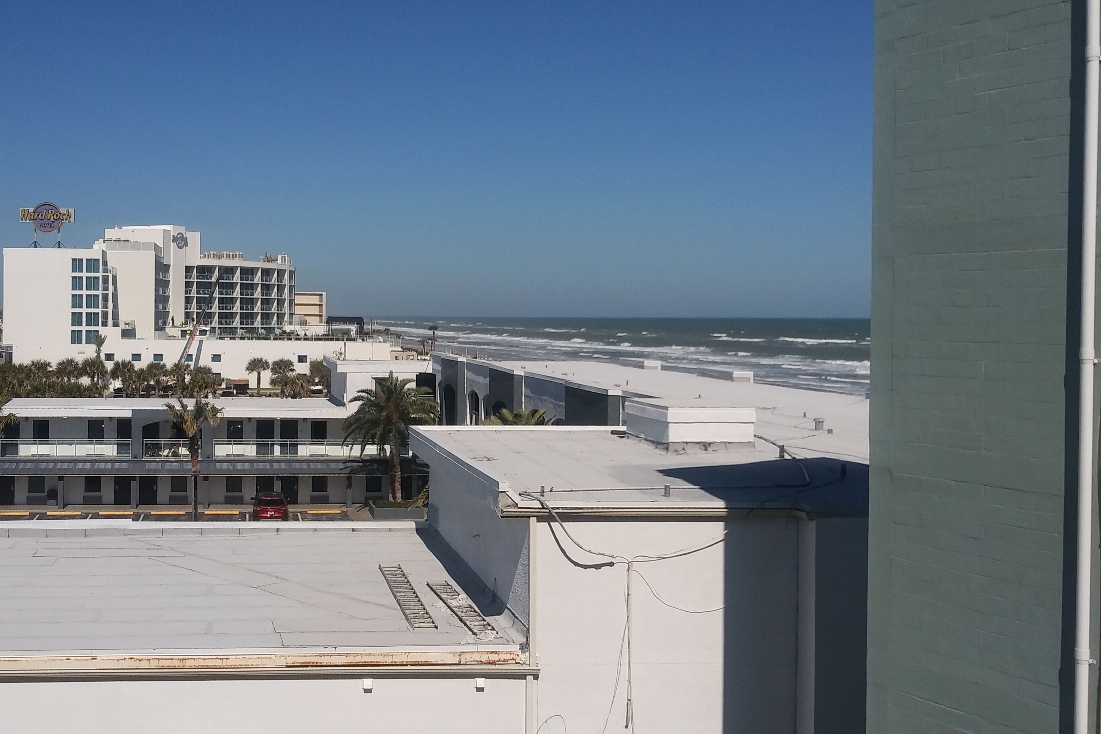 Beachfront studio with intimate balcony, partial ocean views, & kitchenette
