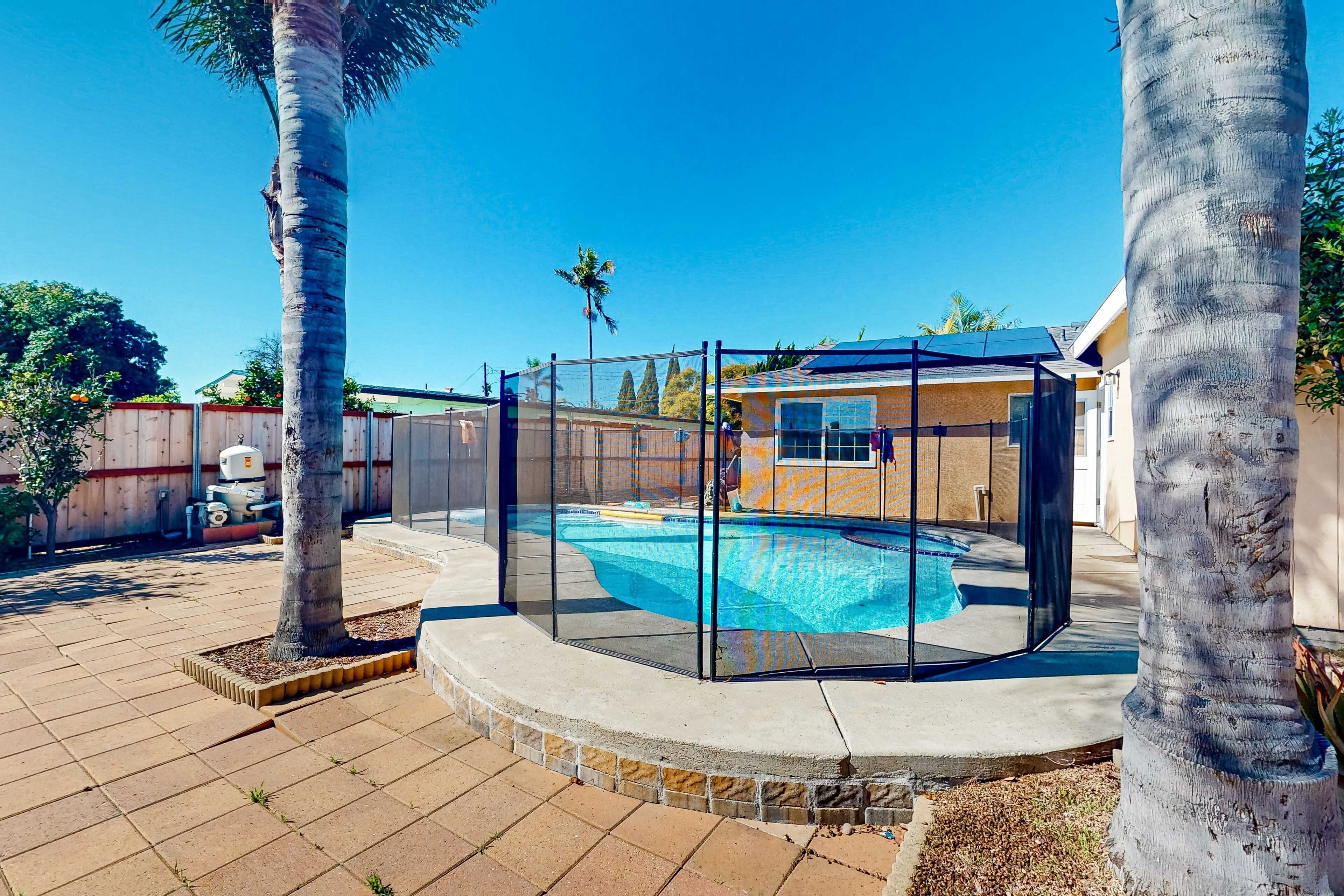 Dog-friendly sunny duplex with pool, foosball, games, alfresco dining, & AC