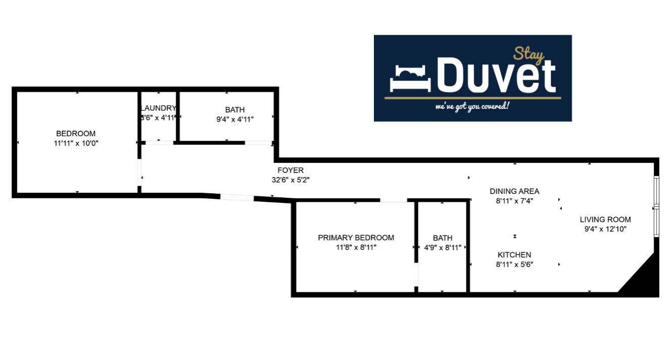 Un plan d’étage d’un hôtel comprenant une chambre, une chambre principale, un coin repas, un salon, une cuisine, une salle de bain et un hall d’entrée.