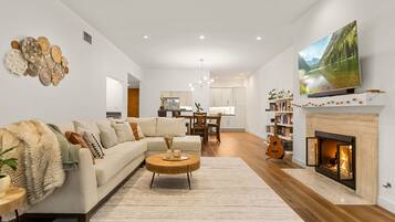 Smart TV, fireplace, books, offices