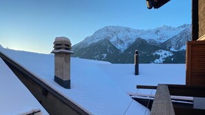 A snowy mountain view from a building's rooftop. - Chalet del Sole  (Quinto)
