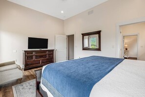 A bedroom with a bed, dresser, television, and a window. - Massive Mountain Retreat, 12 Miles to Asheville! (Candler)