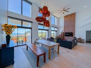 Premium Penthouse | Living area | 60-inch flat-screen TV with digital channels - Elegant Oceanview Penthouse - Steps from Jaco Beach & Nightlife (Jacó)