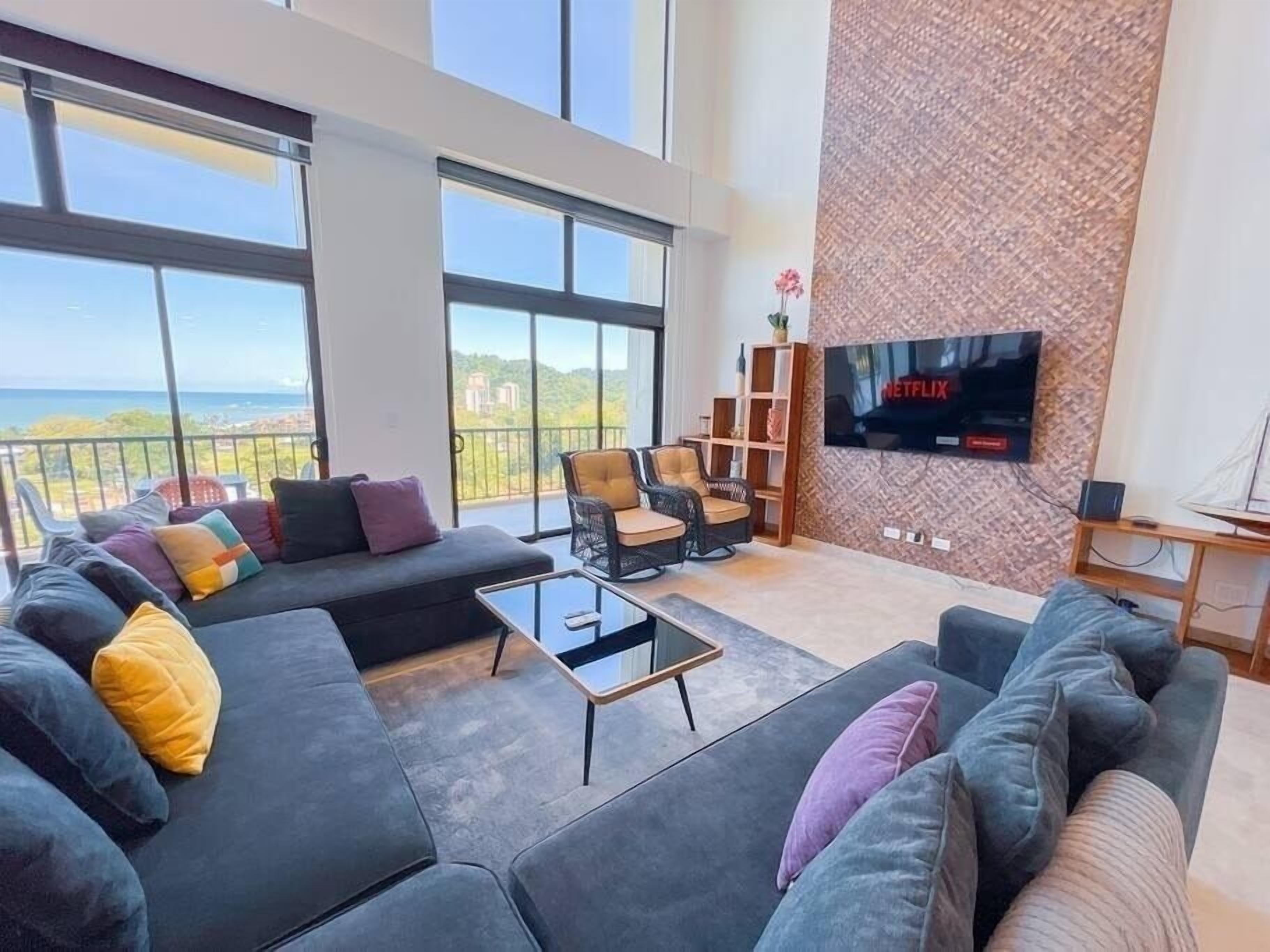 Premium Penthouse | Living area | 60-inch flat-screen TV with digital channels