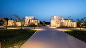 A modern building complex with a central pathway leading to two main structures. - Campo Premium Villa with Private Pool (Kos)