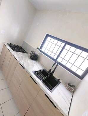 Fridge, microwave, coffee/tea maker, toaster