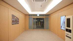 A hotel lobby with a sign reading "HOTEL ACE" and a self-service card deck. - Ace Hotel by Anook Daejeon Yuseong (Daejeon)