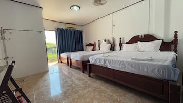 Deluxe Quadruple Room, City View | Egyptian cotton sheets, premium bedding, individually furnished