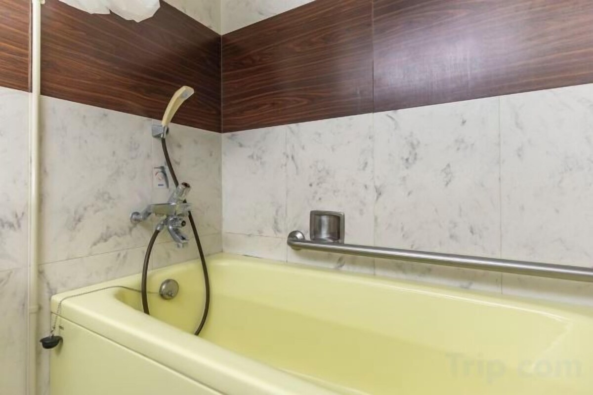 Bathroom | Hair dryer, slippers, bidet, towels
