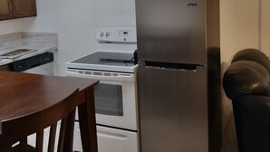 A kitchen with white cabinets, a stainless steel refrigerator, a stove, and a dishwasher. - Horse Ranch House 2 miles to Austin,  Remodeled, Relaxed Atmosphere, SXSW Near (Manchaca)