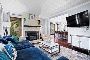 Smart TV, fireplace, books, offices