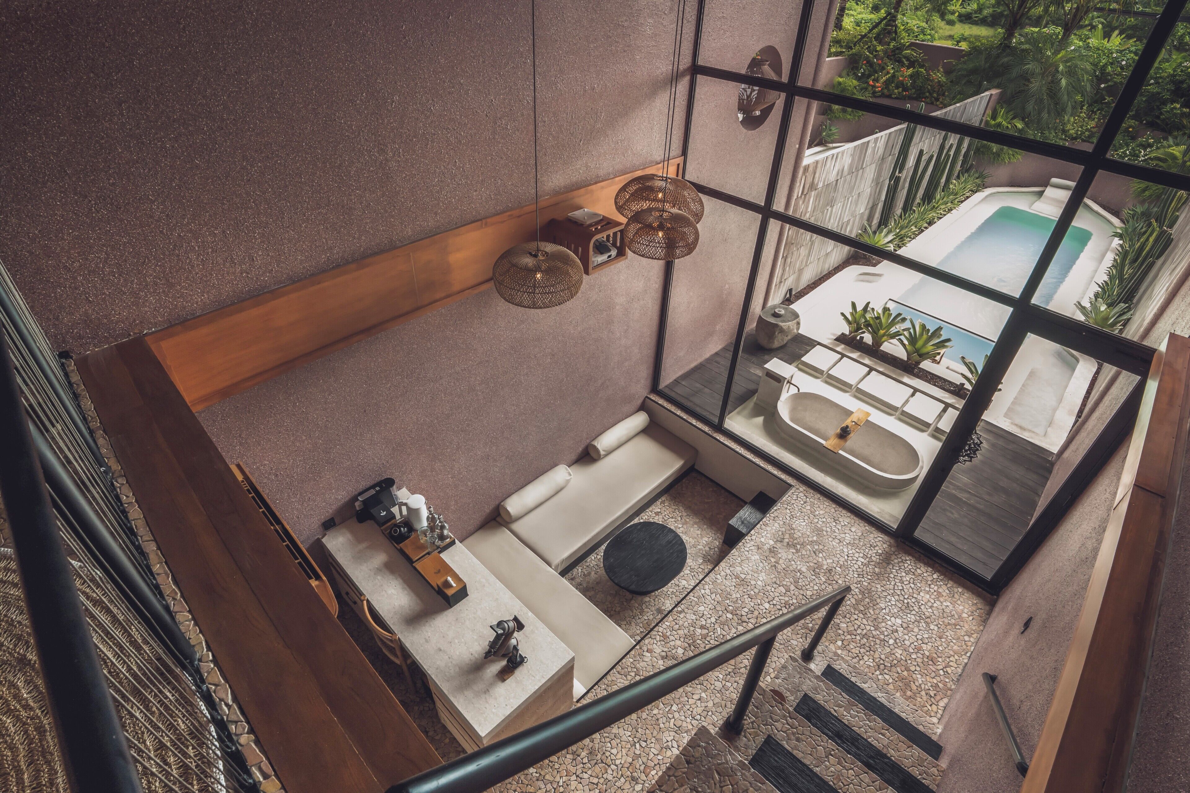 A modern bathroom with a freestanding bathtub, a sink, and a toilet.