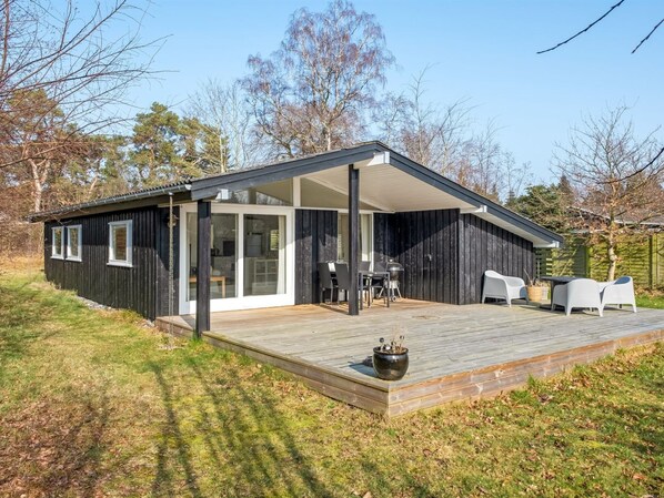 Enjoy outdoor gatherings on the spacious deck with a grill and seating area.