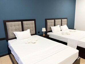 Standard Quadruple Room, Multiple Beds, Private Bathroom | Egyptian cotton sheets, premium bedding, memory-foam beds - Nilo Lanka Hotel (Makumbura South)