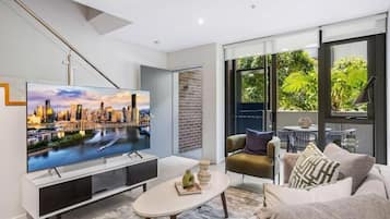 Apartment, 1 Bedroom | Living area | 1-inch LCD TV with cable channels