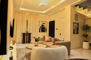 Luxury Duplex | Living area | 32-inch Smart TV with cable channels, Netflix, streaming services