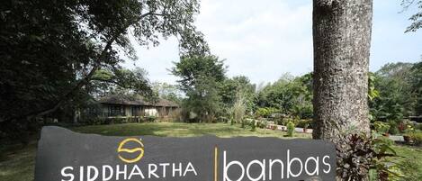 A sign for Siddhartha Vilasa with a logo and name.