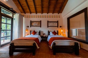In-room safe, desk, laptop workspace, blackout curtains - Banbas Resort, Chitwan (Sauraha)