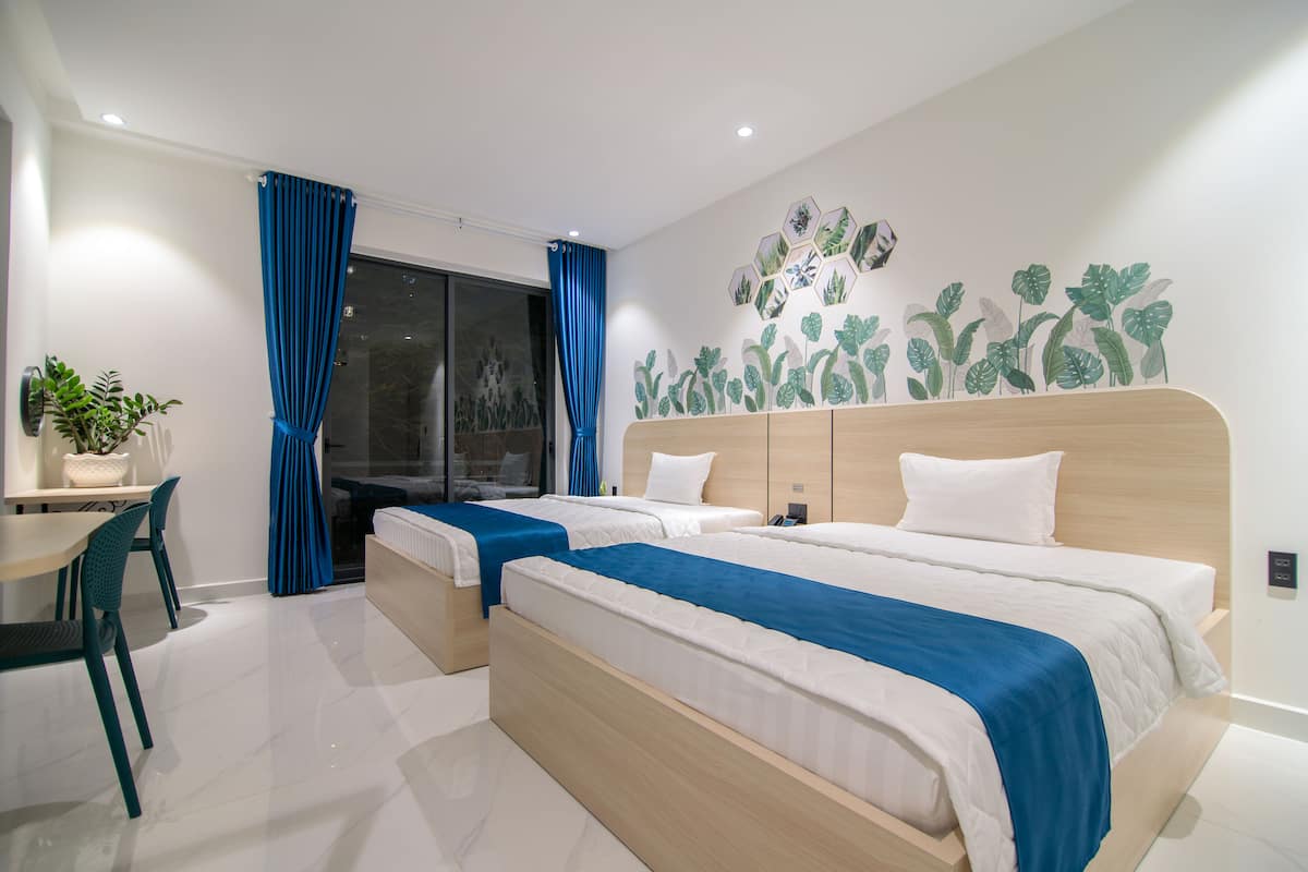 Chambre Deluxe Double ou avec lits jumeaux | Bureau, Wi-Fi gratuit, draps fournis
