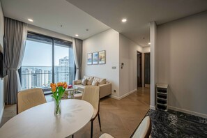 City Apartment, 2 Bedrooms, City View | Living area | Flat-screen TV - Lumiere Riverside Luxury Apartment (Ho Chi Minh City)