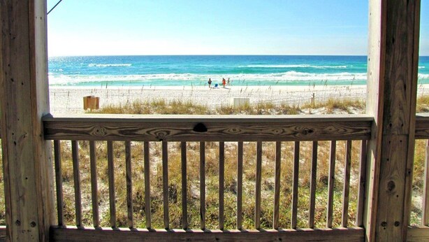A wooden deck with a view of a beach and ocean. - Sea Albert-King Beds-Pet Friendly-Walk2Beach (Miramar Beach)