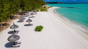 On the beach, sun-loungers, beach towels