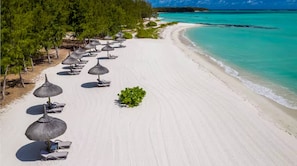 On the beach, sun-loungers, beach towels