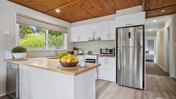 Fridge, coffee/tea maker, cookware/dishes/utensils