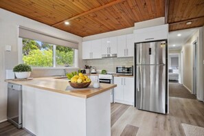 Fridge, coffee/tea maker, cookware/dishes/utensils