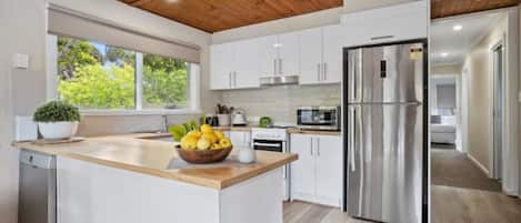 Fridge, coffee/tea maker, cookware/dishes/utensils