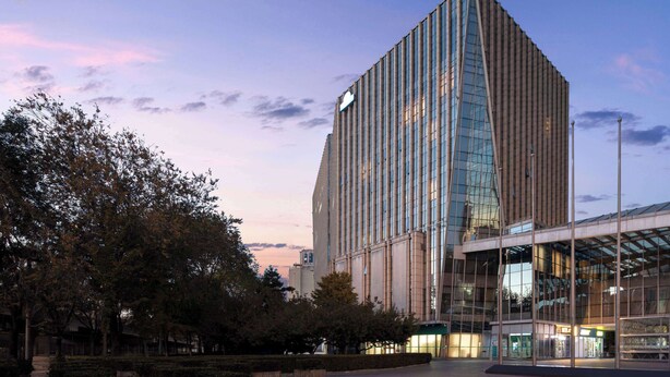 A modern building with a glass facade and a unique angular design. - Days Inn by Wyndham Beijing Haidian (Beijing)