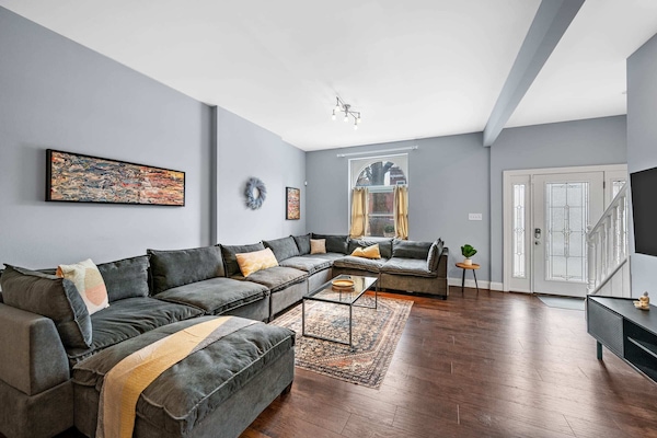 If this sectional isn't relaxing than I don't know what is? Sink into this cozy couch and relax after a long day of exploring the city!