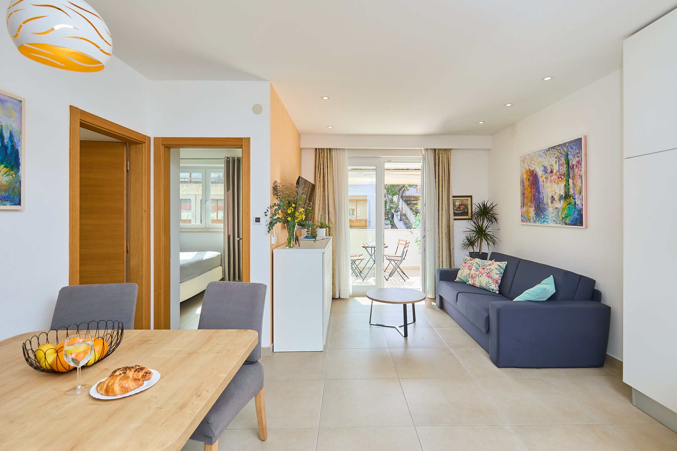 Apartment (2 Bedrooms) | Living area | 140-cm Smart TV with cable channels