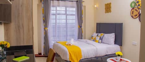 Departamento estándar, 1 cama Queen size | Área de sala de estar