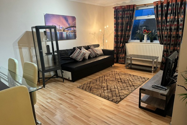 Family Apartment, 2 Bedrooms | Living area | Flat-screen TV, fireplace