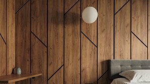 A modern bedroom with a wooden panel wall, a round pendant light, a bed with white linens, and a small black ottoman. - Nest Inn Mirror Apartment (Cluj-Napoca)