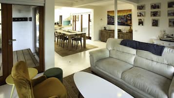 Comfort House | Living area | 42-inch flat-screen TV with satellite channels