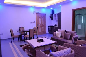 Family Apartment, 3 Bedrooms | Living area | 50-inch LCD TV with satellite channels - Refal Homes (Jeddah)