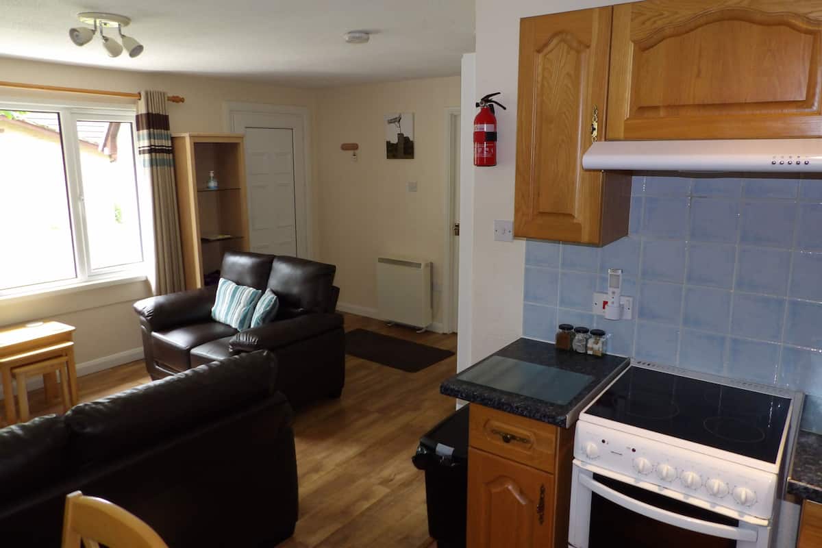 Family Bungalow, 2 Bedrooms | Living area | 32-inch Smart TV with digital channels, DVD player
