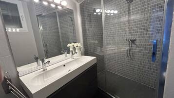 Shower, hair dryer, towels, soap