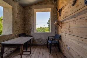 Enjoy a peaceful atmosphere with a view of lush greenery from the large window.